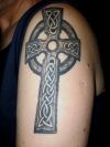 celtic cross left arm tattoo